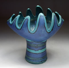 Fong Chow, designer decorated by Glidden Parker Gulfstream Blue Artware, Slotted Vase, 4000 Series stoneware, glazed h: 9-1/2” w: 9-3/8” d: 6-1/2” gift of Chaoling and Fong Chow S-JIMCA, 1992.32, 33