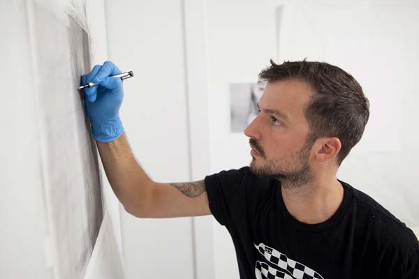 Kelcy Chase Folsom drawing on a piece of paper