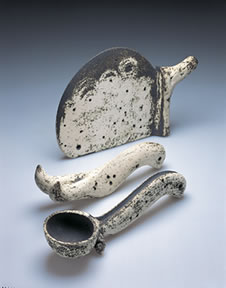 William Parry, KFS #15 from the knife, fork and spoon series. 1991-1992, white stoneware with copper oxide slip, h: 10-3/4" w: 16-1/2" d: 3-1/4" (knife) gift of Elizabeth Parry, S-JIMCA