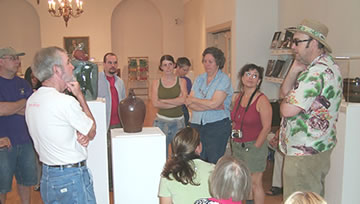 John Gill, on the far right, lecturing in the Museum