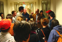 Peter Schjeldahl talks with students at the reception following his lecture